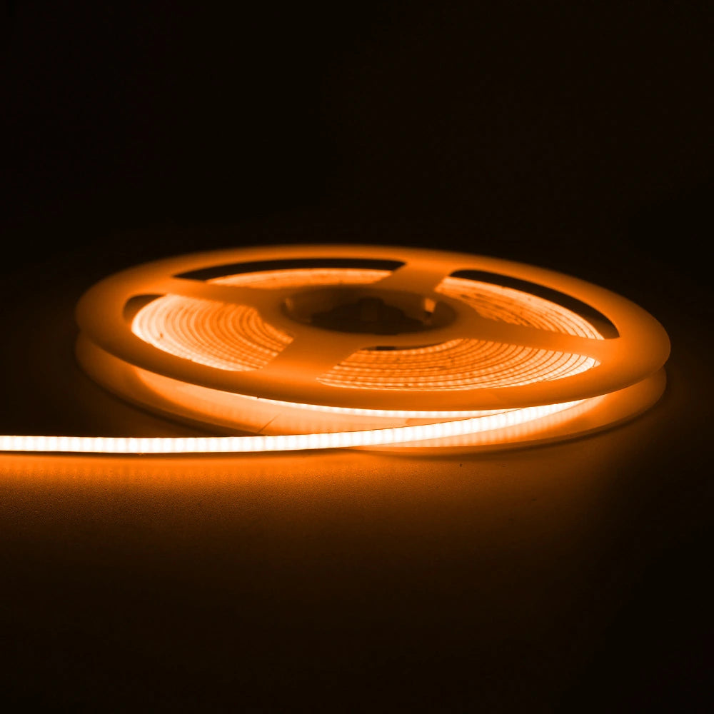 2.7mm COB LED strip shown lit in warm white