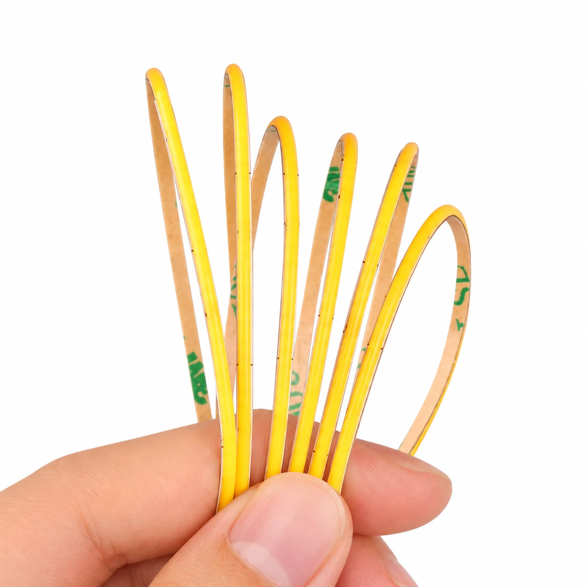 2mm ultra-thin COB LED strip light close-up showing the continuous 480 LEDs/m phosphor line